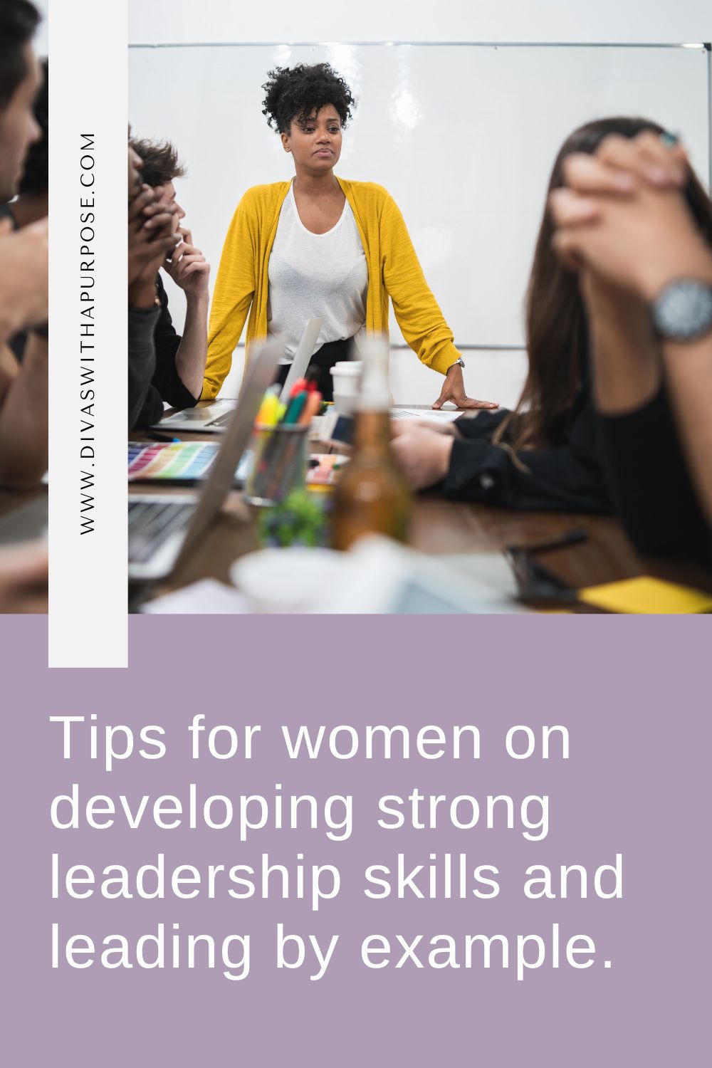 Woman leading by example at the head of a conference table for a team meeting