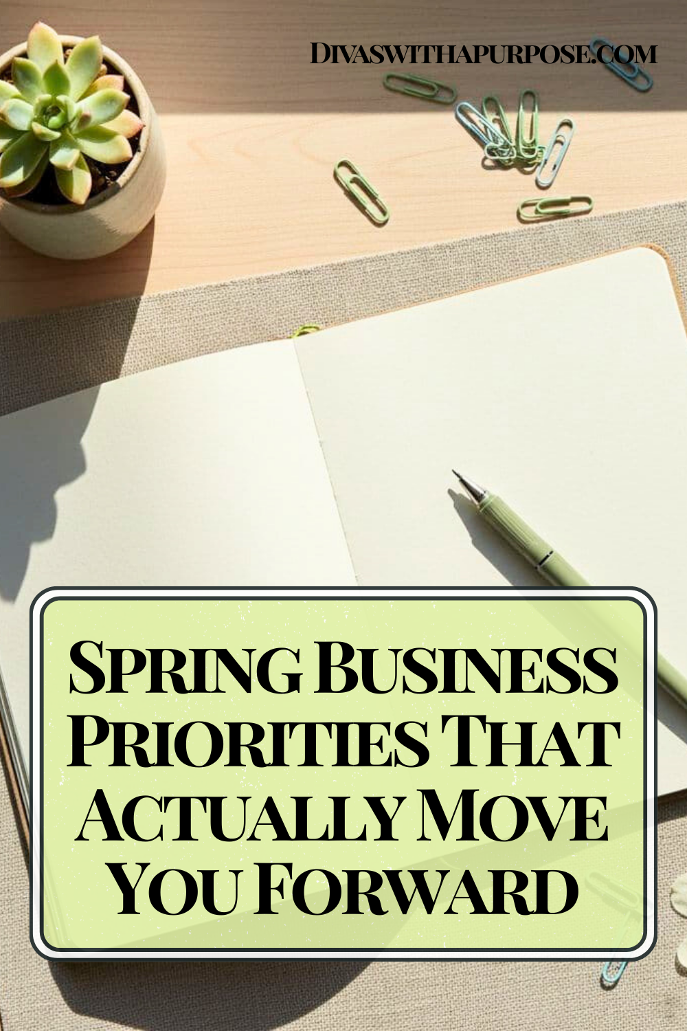 Spring workspace flat lay with open notebook, green pen, succulent plant, and paper clips on a light desk with text overlay about spring business priorities