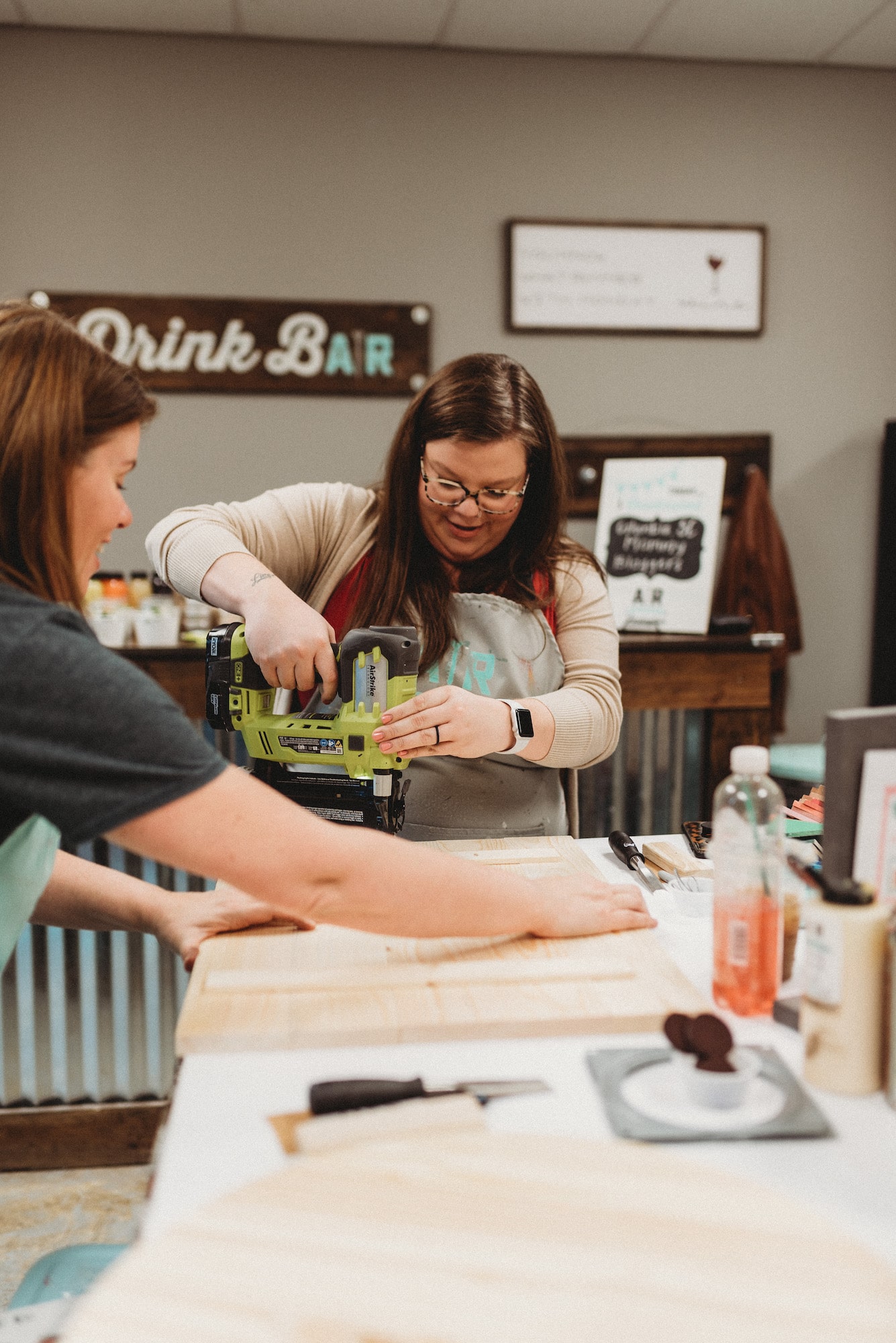 while it's tempting to get all dressed up for a girls' night out, keep in mind you're going to handle wood, paint, and possibly power tools. It's okay to dress down. You'll be wearing an oh-so-stylish AR Workshop-provided smock