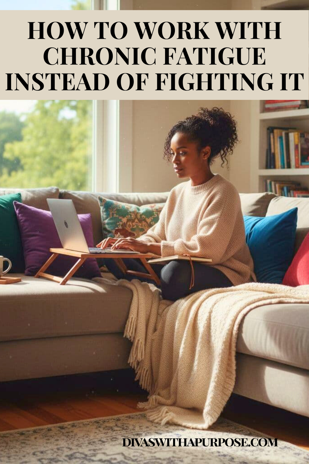 Black woman working comfortably from a couch using a laptop desk, illustrating how to work with chronic fatigue instead of fighting it.