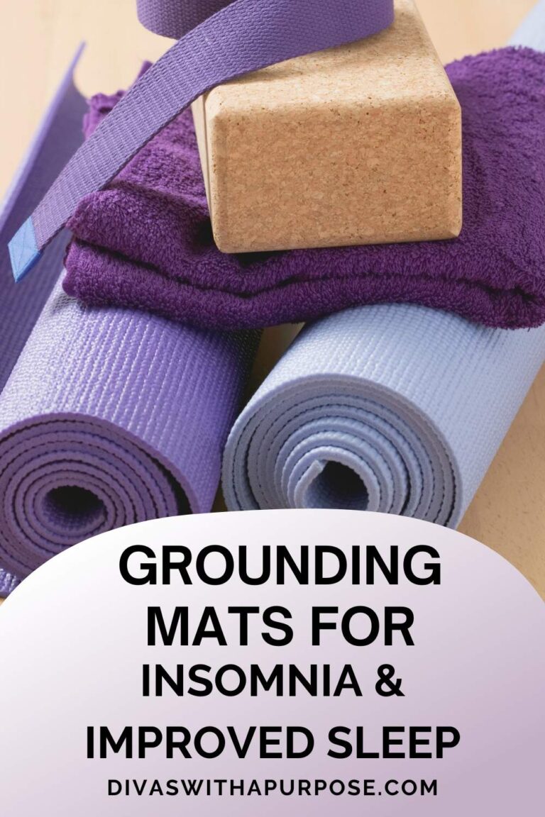 A stack of purple and blue yoga mats with a cork block, symbolizing relaxation and grounding. Grounding mats are an effective natural remedy for insomnia and improved sleep.