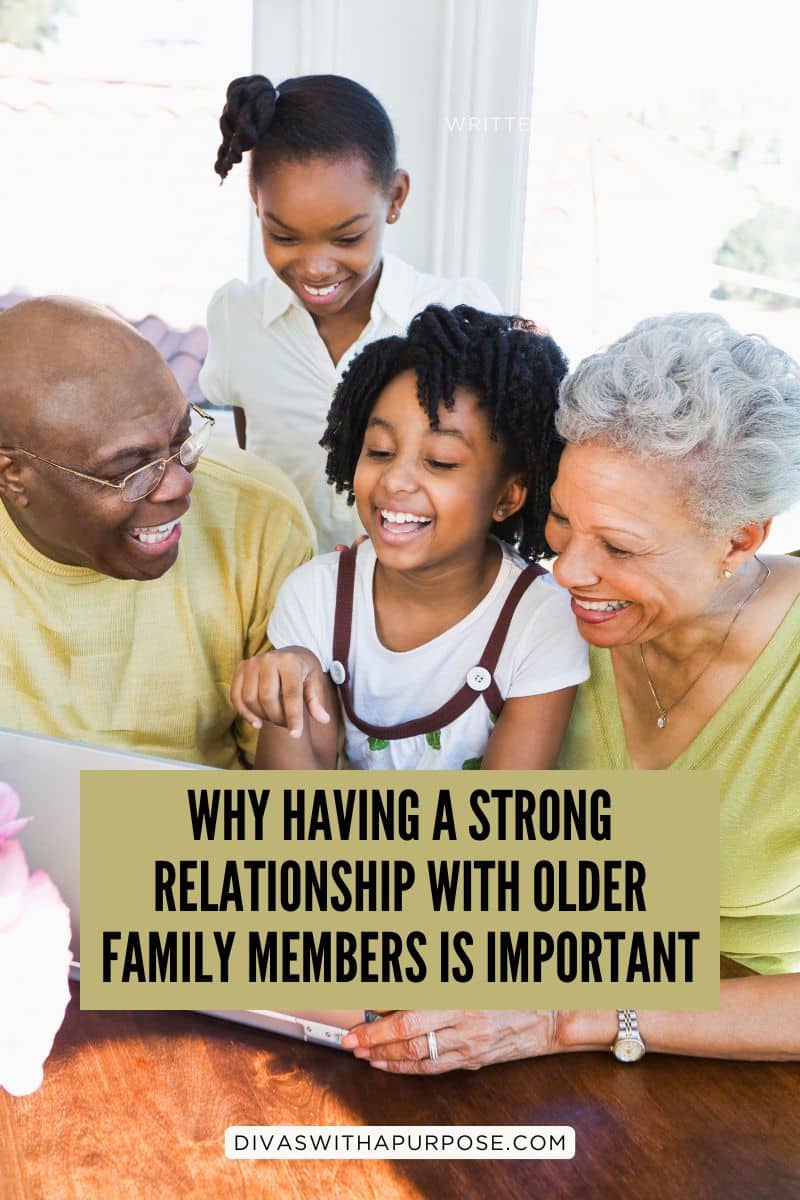 Three generations of an African American family smiling and spending time together while looking at a tablet, representing the importance of relationships with older family members.
