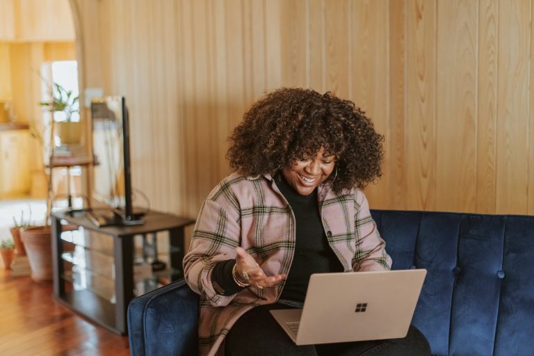 New entrepreneur working on a laptop from home while building a business