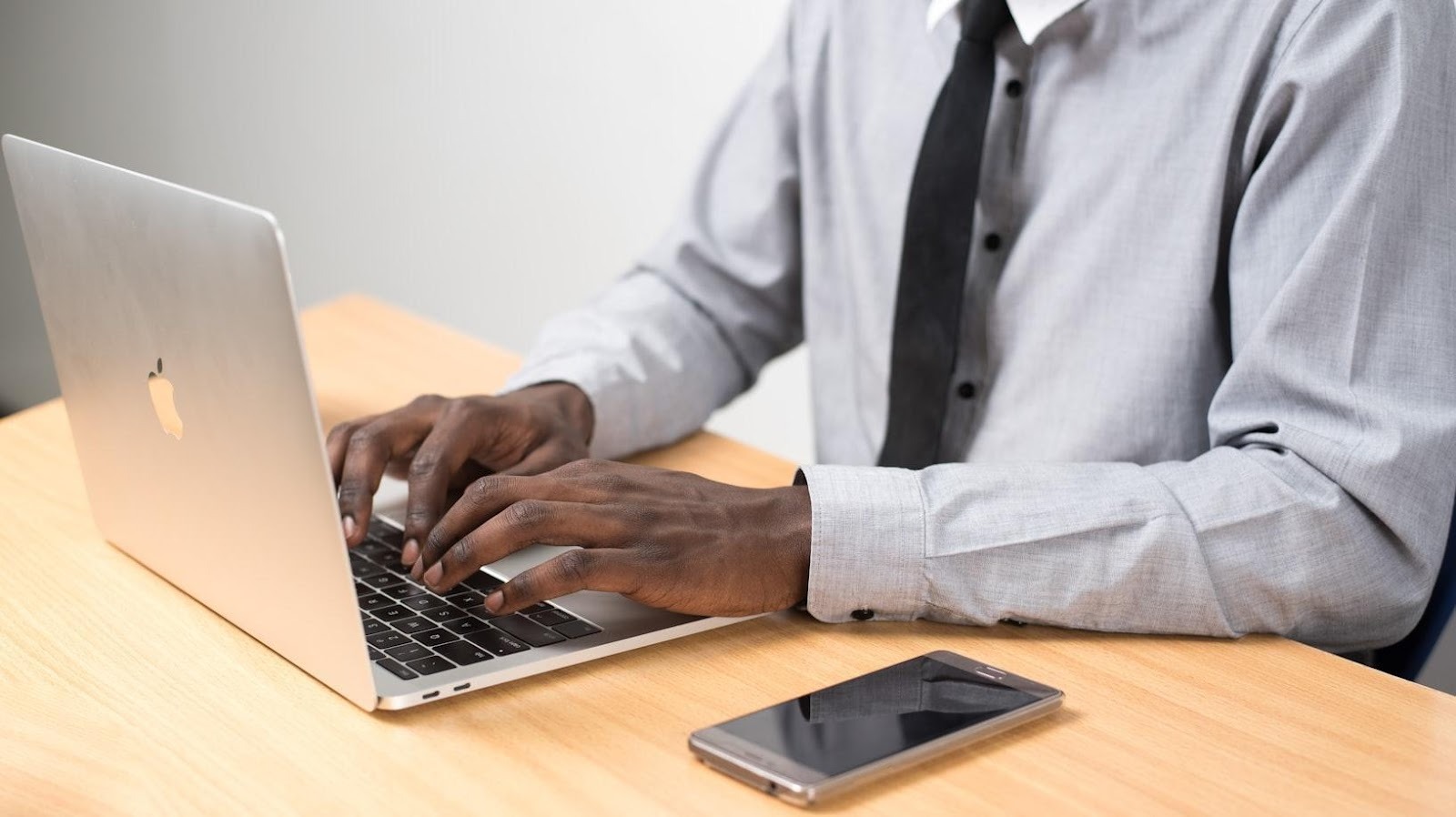 Professional reviewing investment options on a laptop at a desk