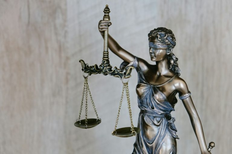 Statue of Lady Justice holding scales and sword