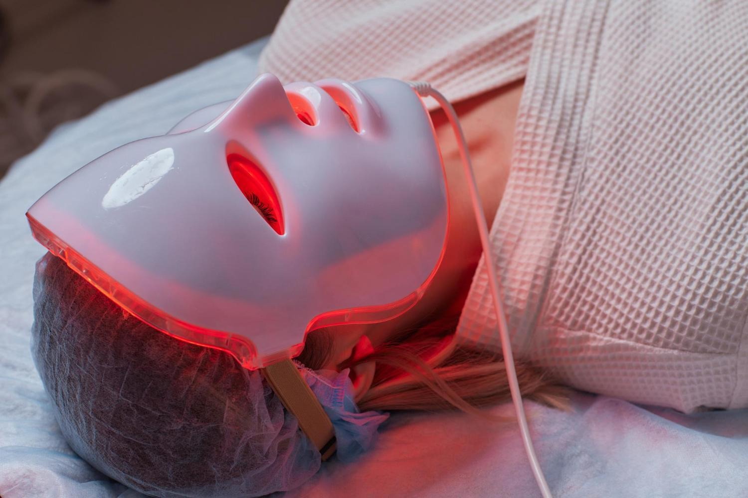 Red light therapy mask used as part of an at-home skincare routine