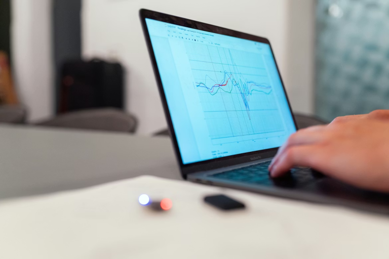 Laptop displaying healthcare CRM analytics dashboard with performance data and patient insights