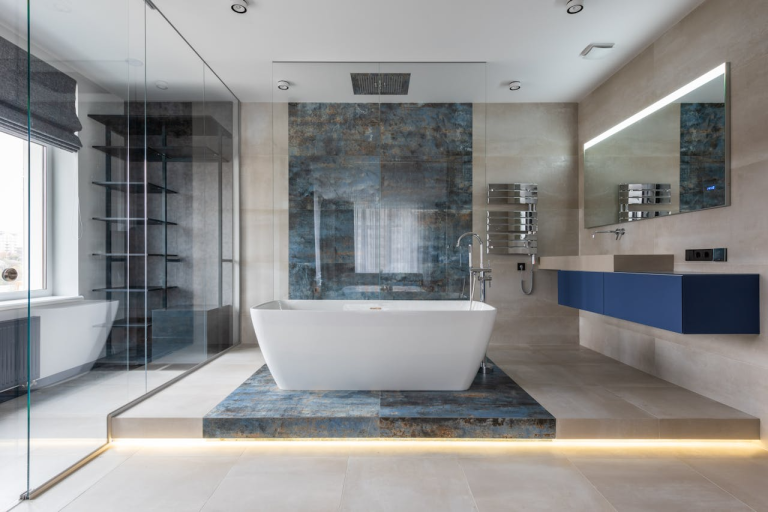 Modern spa-style bathroom with freestanding tub, glass shower, and soft lighting