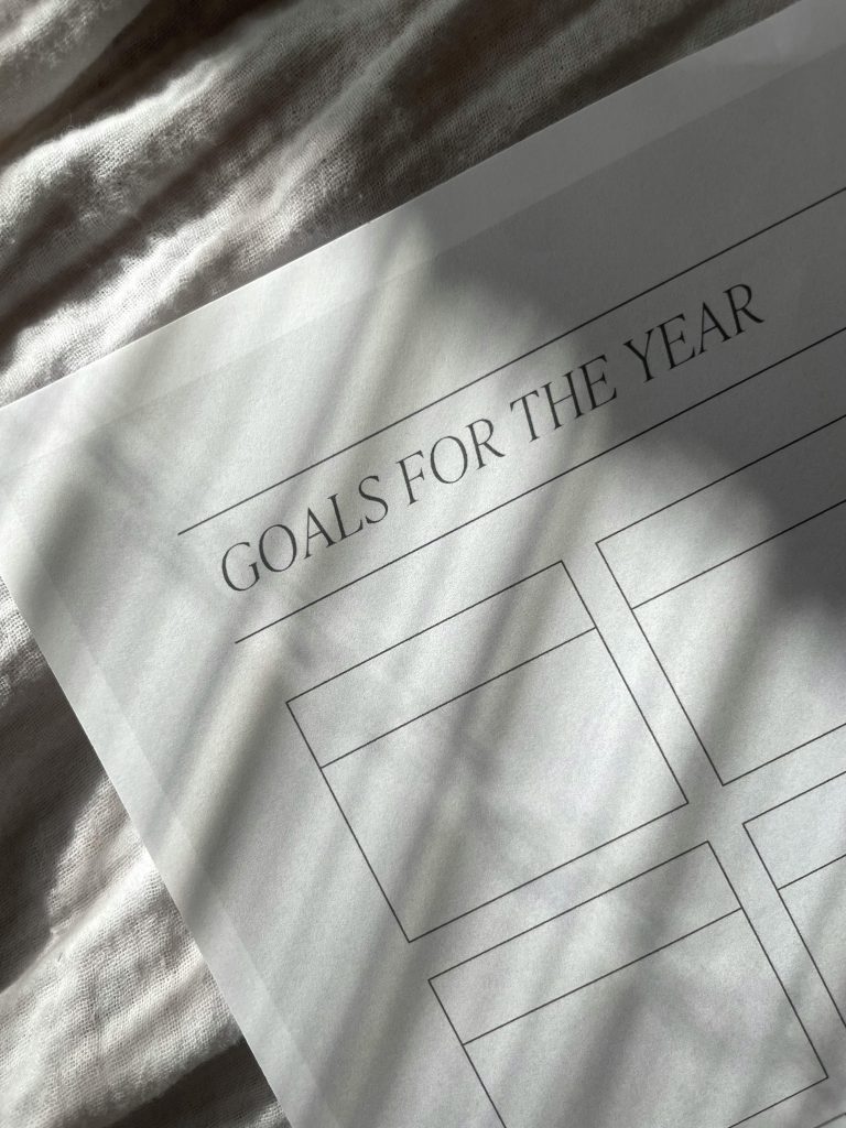 Goals for the year worksheet resting in soft natural light at home