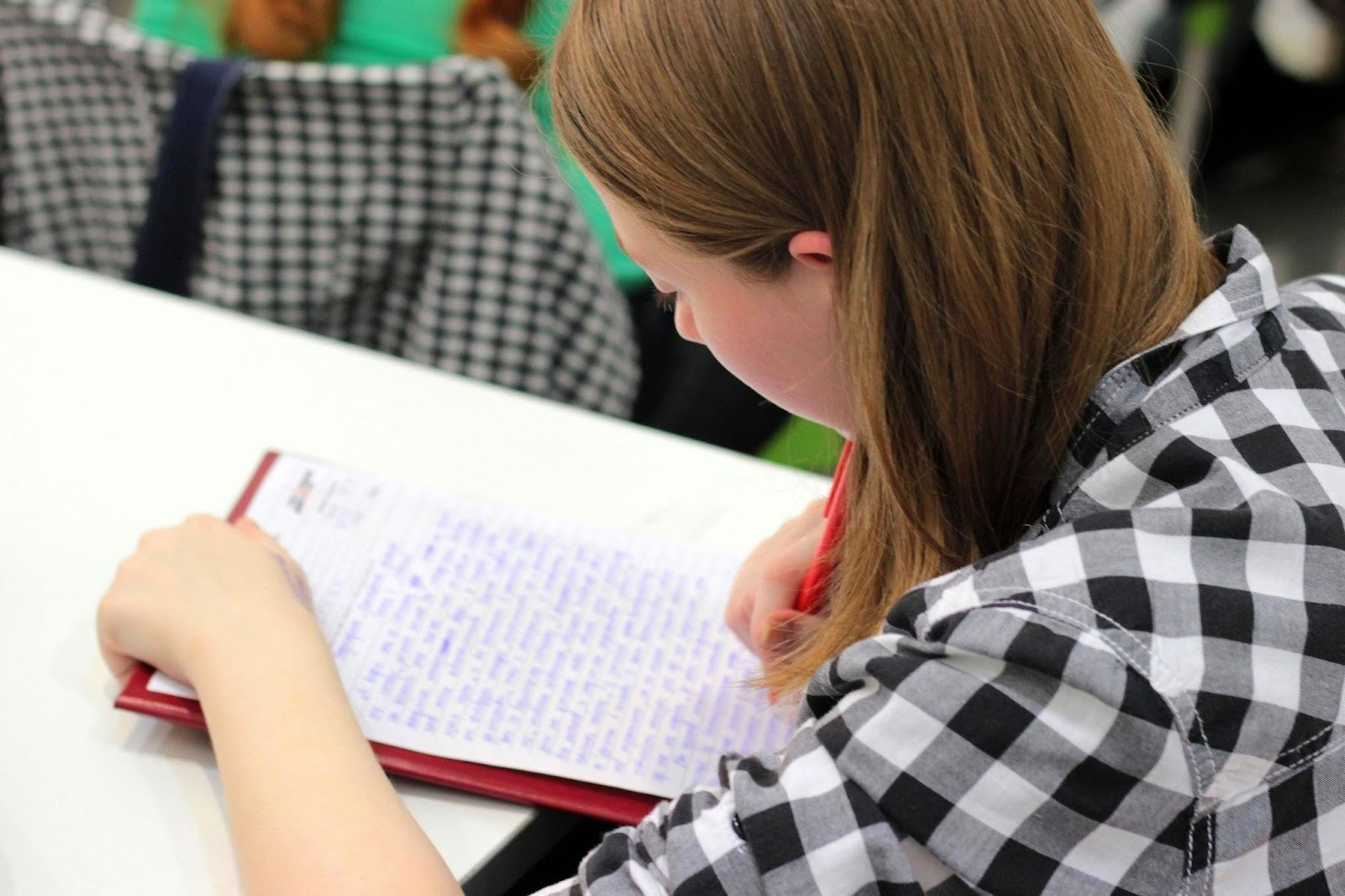 student completing classroom assignment in supportive school learning environment