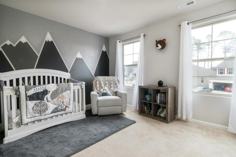 modern nursery with crib, chair, and simple layout for comfort and function