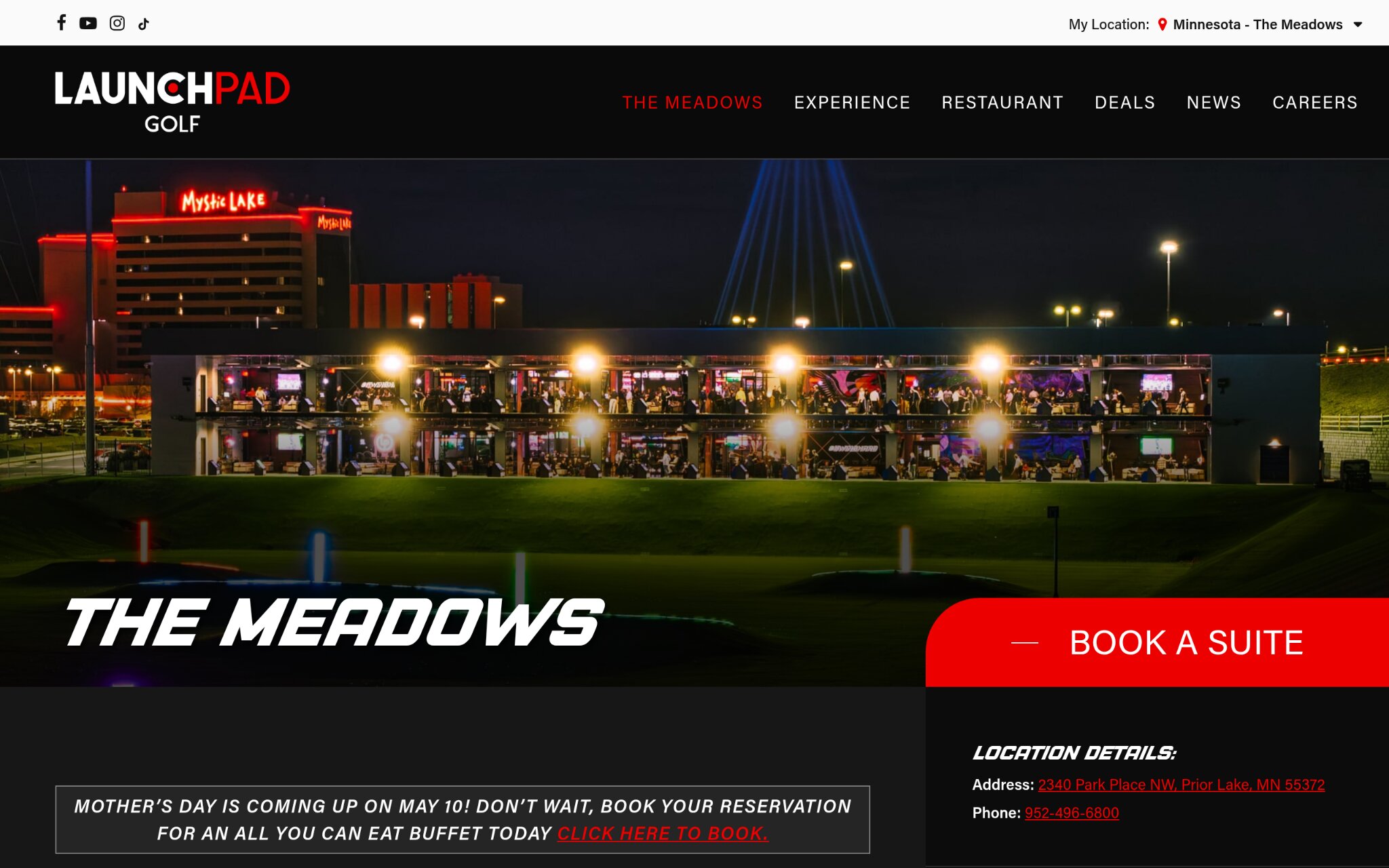 outdoor golf simulator venue at night with multiple bays and lights at LaunchPad Golf