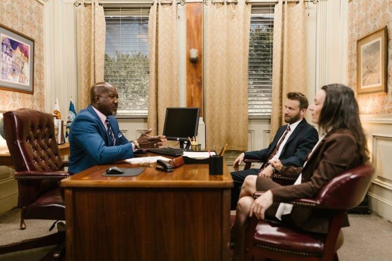 A woman professional consulting an attorney in an office