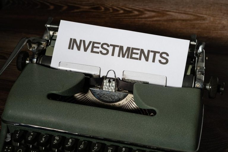 Typewriter displaying the word investments for retirement and financial planning