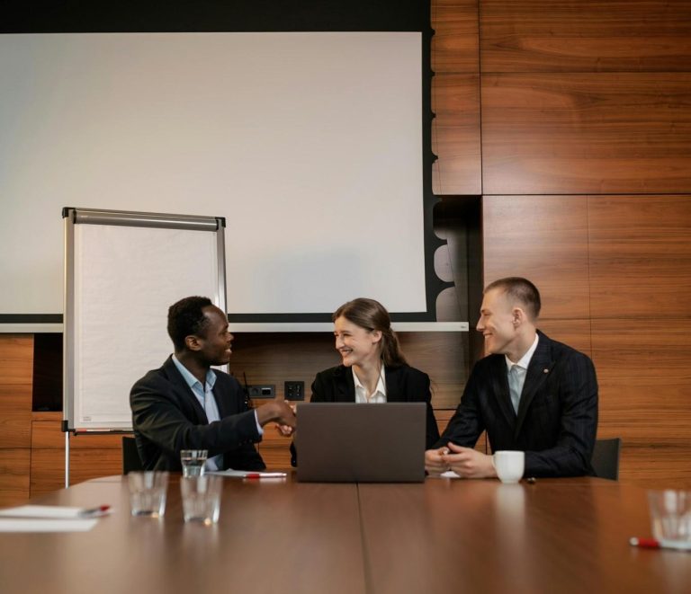 Business professionals meeting together during a workplace training or strategy session.