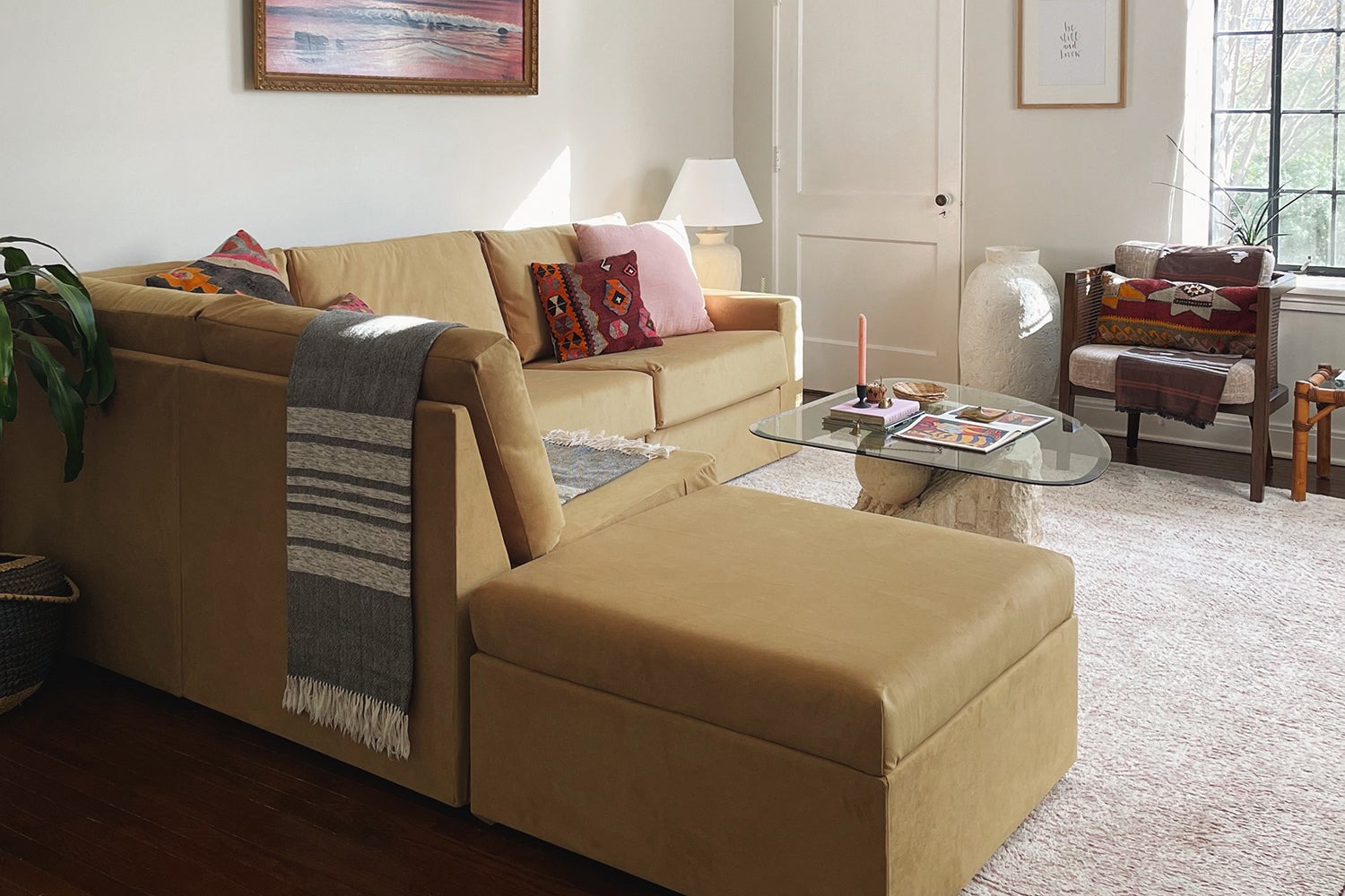 A brown couch in a cozy living room.
