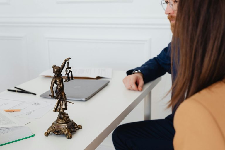 Business owners meeting with a lawyer during a legal consultation for startup support.