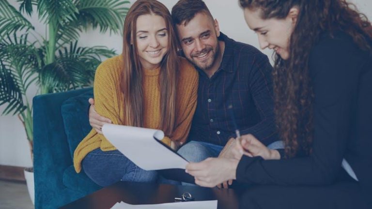 A woman professional consulting with a financial advisor in an office setting