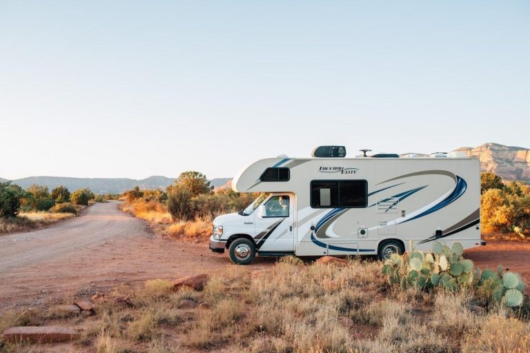 Motorhome parked along a scenic desert road during an RV travel adventure.