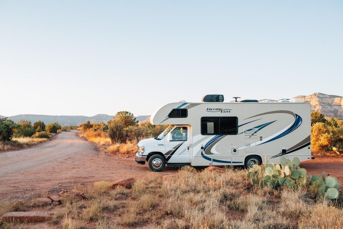 Motorhome parked along a scenic desert road during an RV travel adventure.