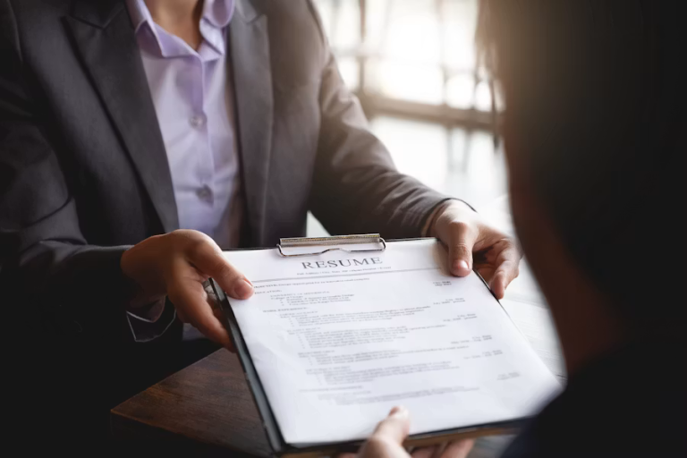 Professional reviewing a resume during a job interview while exploring career opportunities that support work-life balance