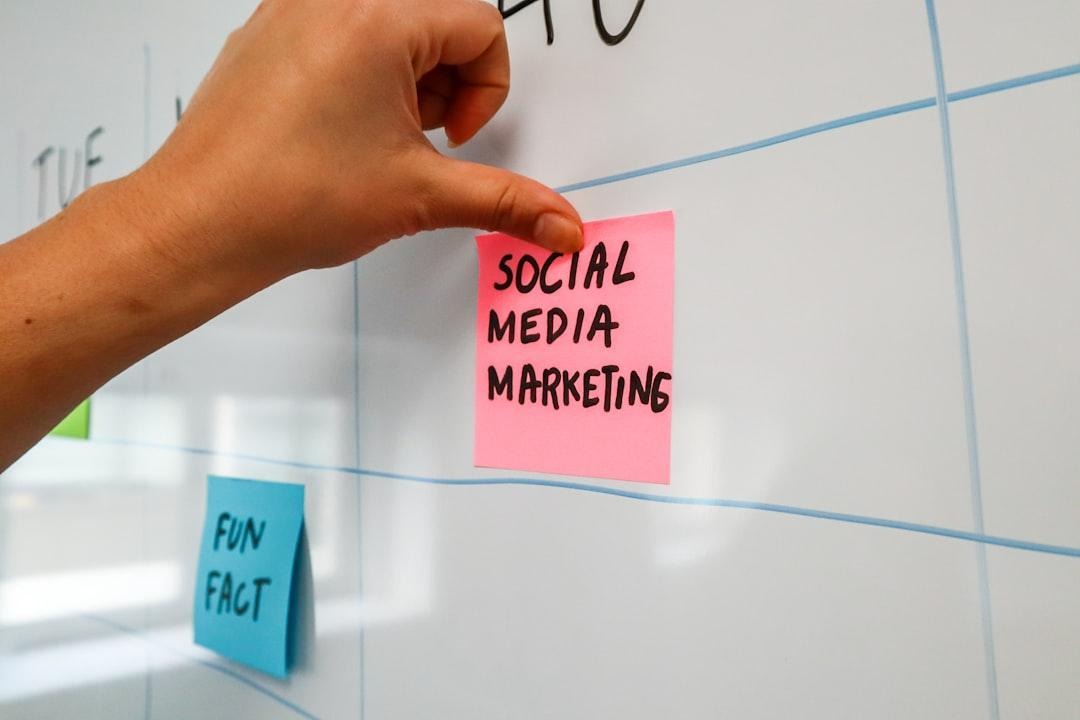 Small business owner planning a social media content calendar on paper