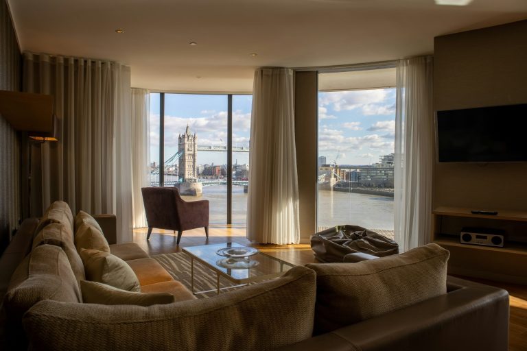 Comfortable private rehabilitation suite with large windows overlooking a peaceful waterfront