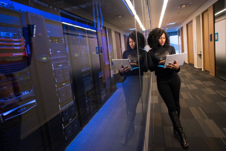 Business professional reviewing digital infrastructure and server technology to support startup growth and operational efficiency
