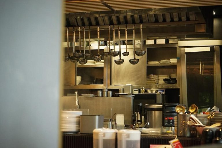 A professional commercial kitchen with stainless equipment