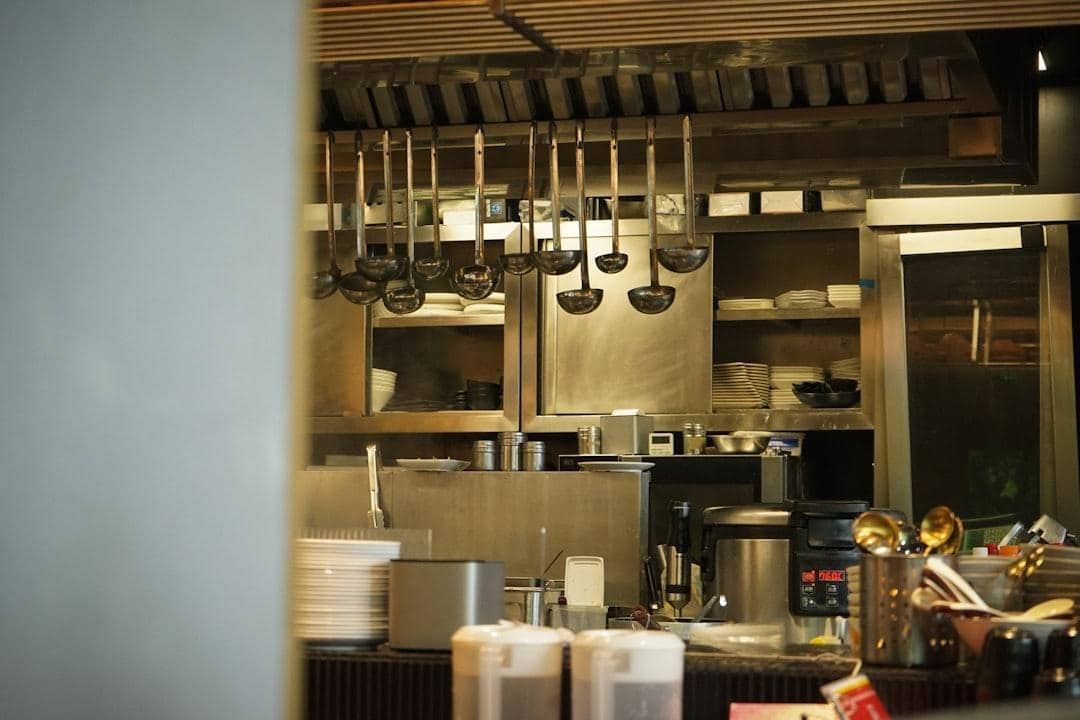 A professional commercial kitchen with stainless equipment