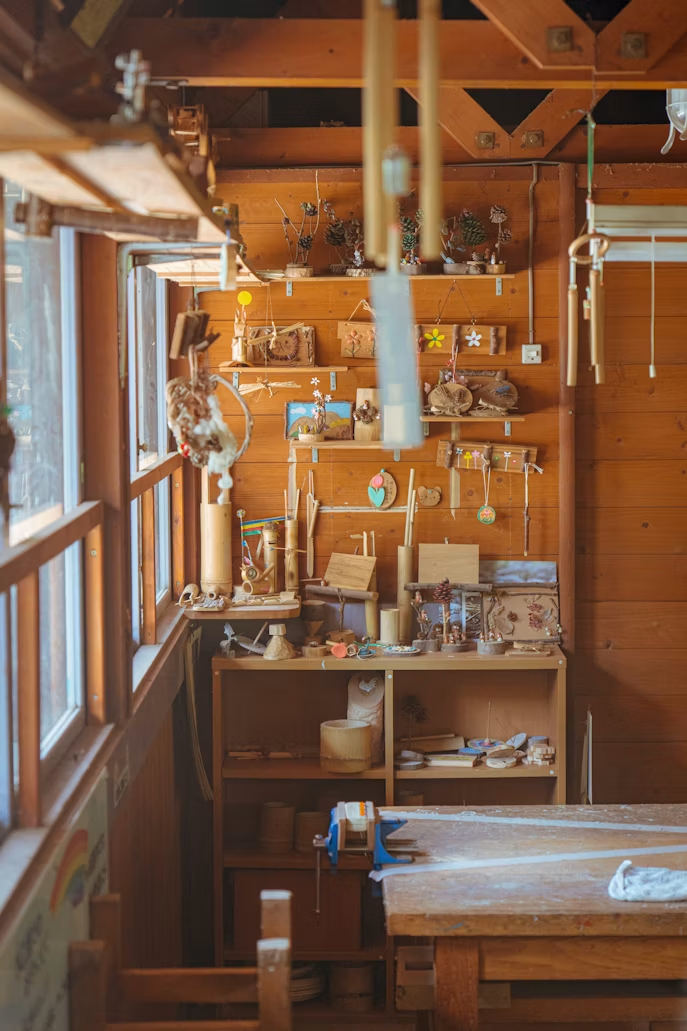 Clean and organized garage workshop with shelves, tools, and storage for family hobbies and DIY projects.