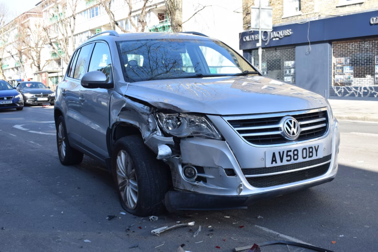 Damaged SUV after a vehicle collision illustrating the legal steps after an accident