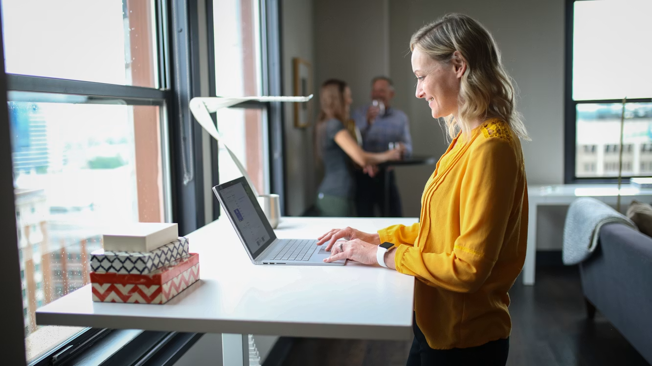 Entrepreneur reviewing business finances on a laptop while building a positive money mindset and financial confidence.