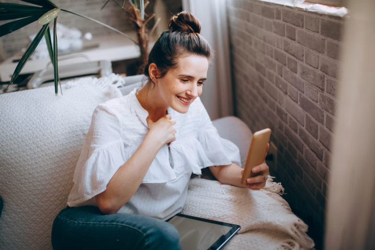 Woman using her smartphone to engage with visual content online
