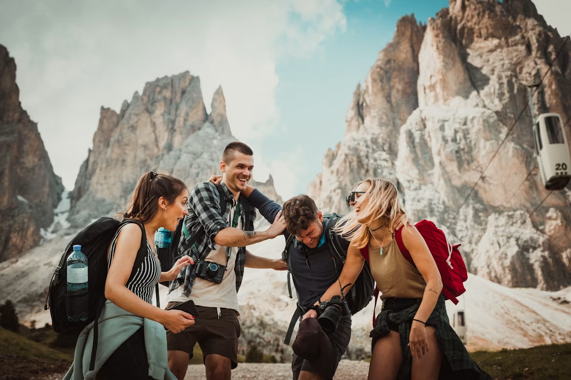 Group of friends enjoying a mountain adventure during a celebration getaway