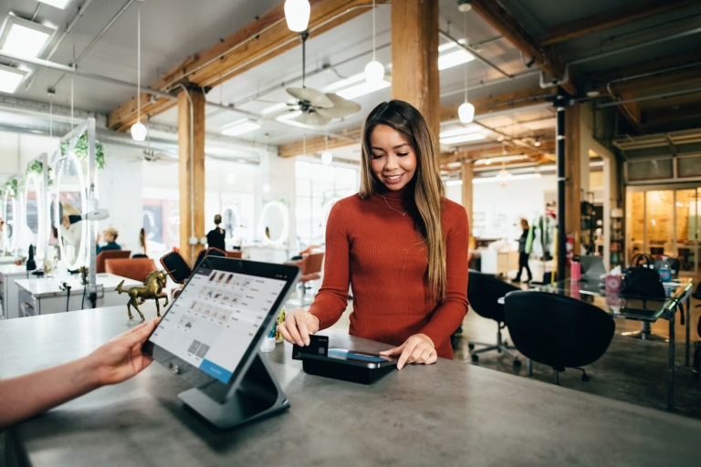 Customer making a payment at a small business checkout counter