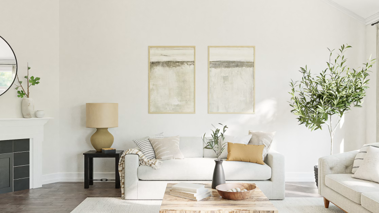 Bright, uncluttered living room with neutral decor, natural light, and indoor plants