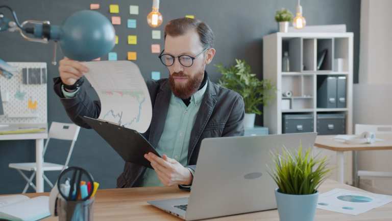 Investor reviewing financial reports and data during the due diligence process
