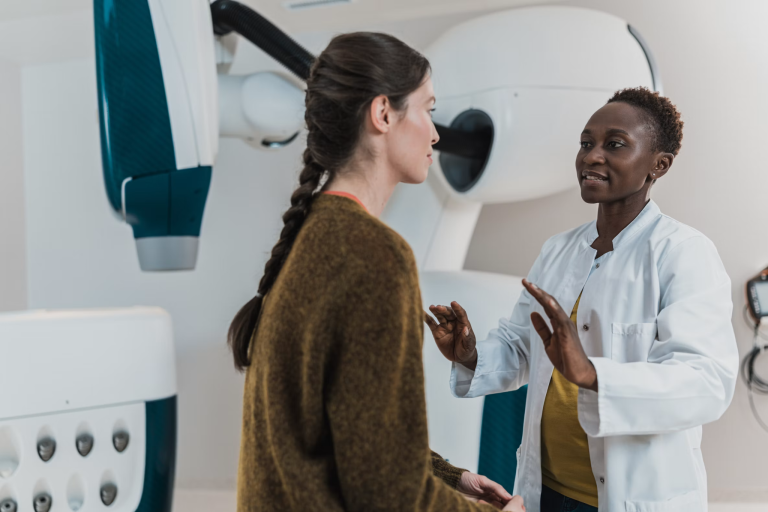 Doctor speaking with a patient about healthcare and medical coverage