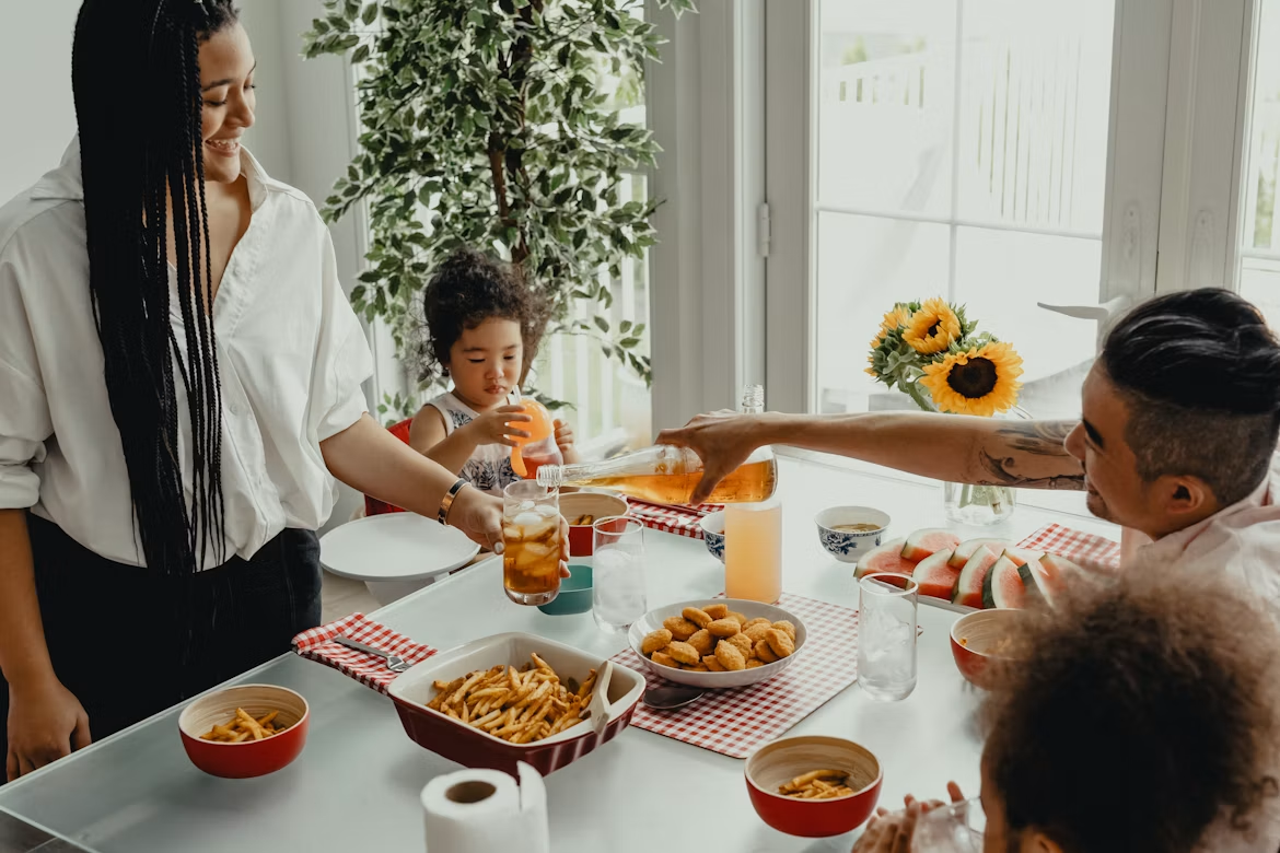 Family sharing a meal together around the dining table
