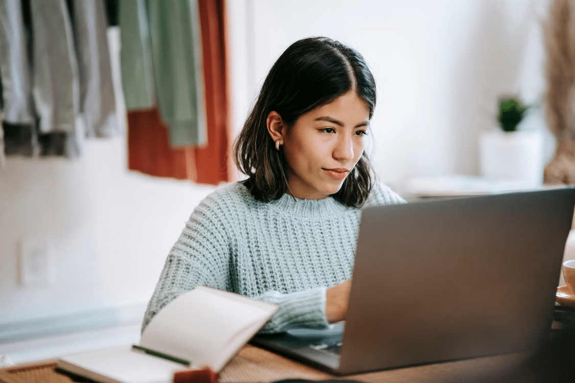 Small business owner working securely on a laptop at her desk